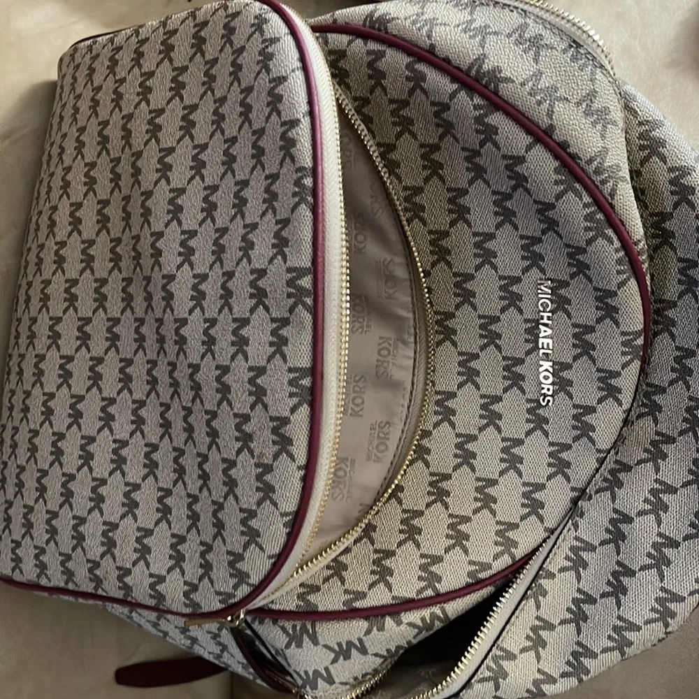 Michael Kors backpack a regular sized. Tan & burgundy with all the zippers. - Picture 4 of 8